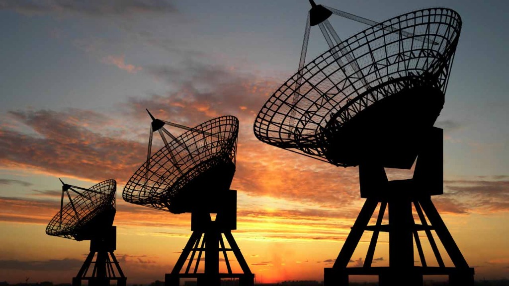 Laku Media Satellite Dish Array Silhouette at Sunset